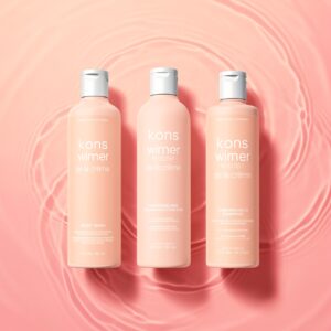 Free AI photo: Kons Winner De La Crème Products. Sleek shampoo bottles on a soft pink background create a calming scene.. Categories: Fashion, Mockups. Colours: Red, Orange.