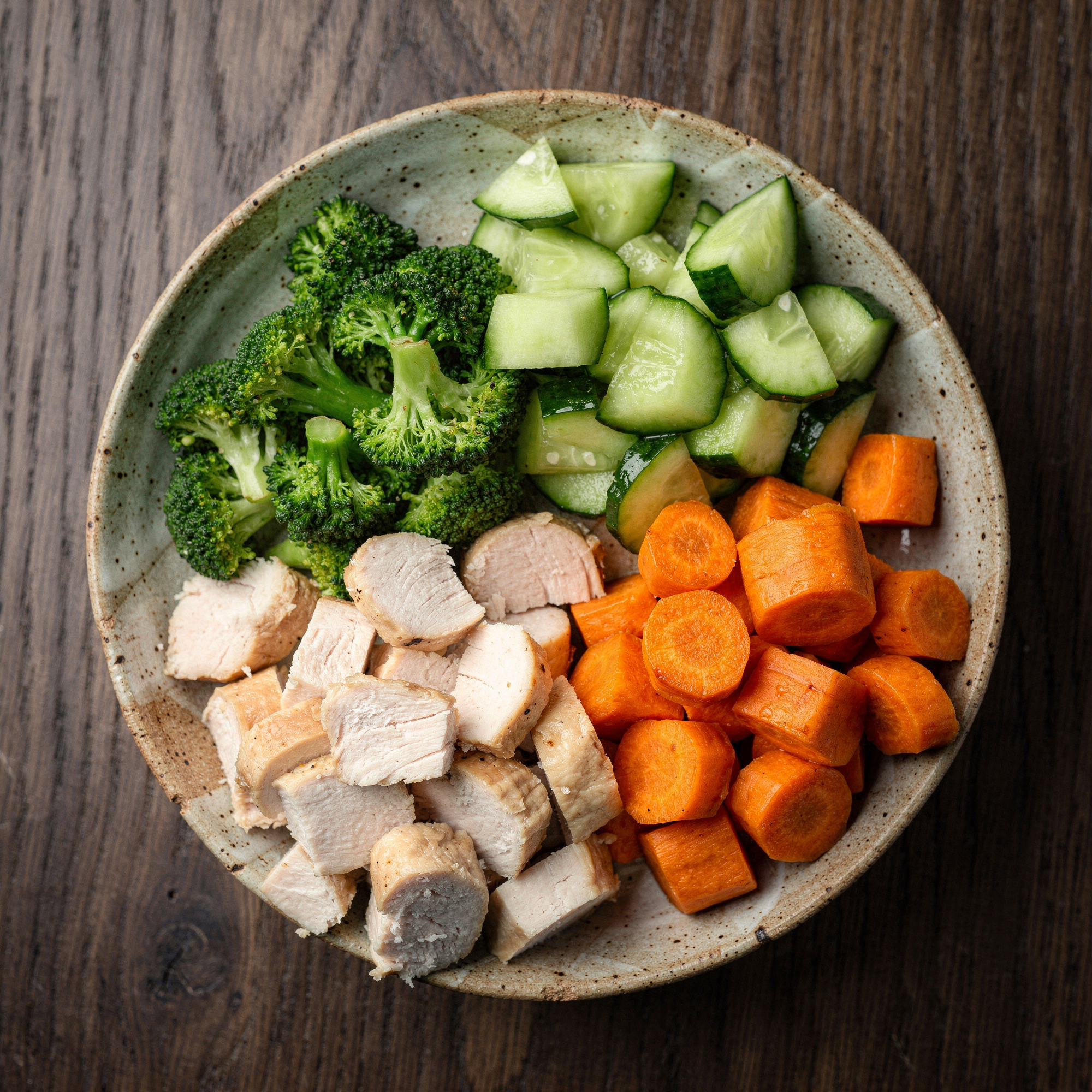 Free AI photo: Rustic Chicken And Vegetable Bowl. A delicious and healthy meal is presented on a dark wood table.. Categories: Food & Drink, Photography. Colours: Orange, Gray, Green.